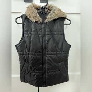 Black vest with faux fur zip hood. Women’s S